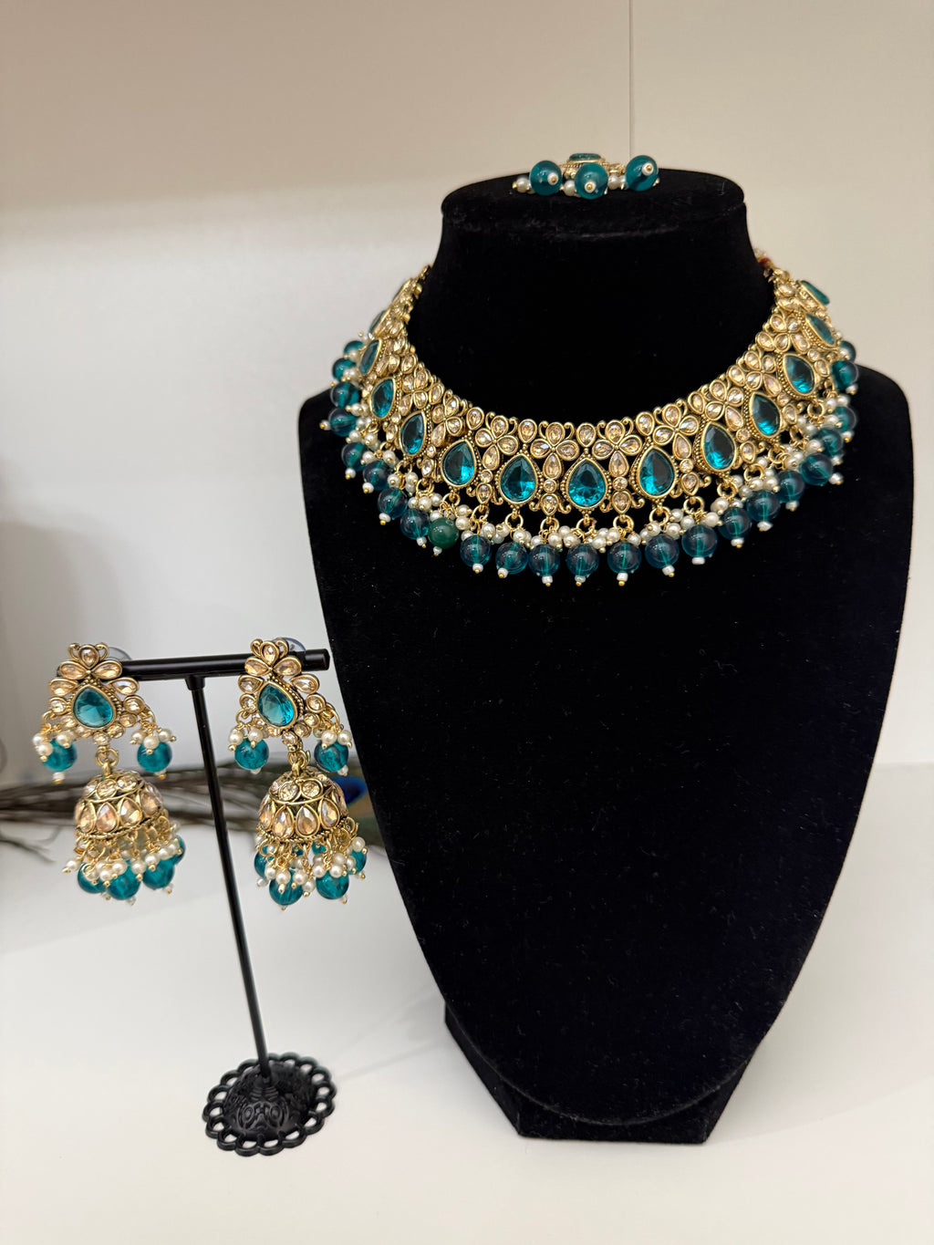Kundan choker necklace (gold-tone with teal/emerald-colored stones and pearl drops)