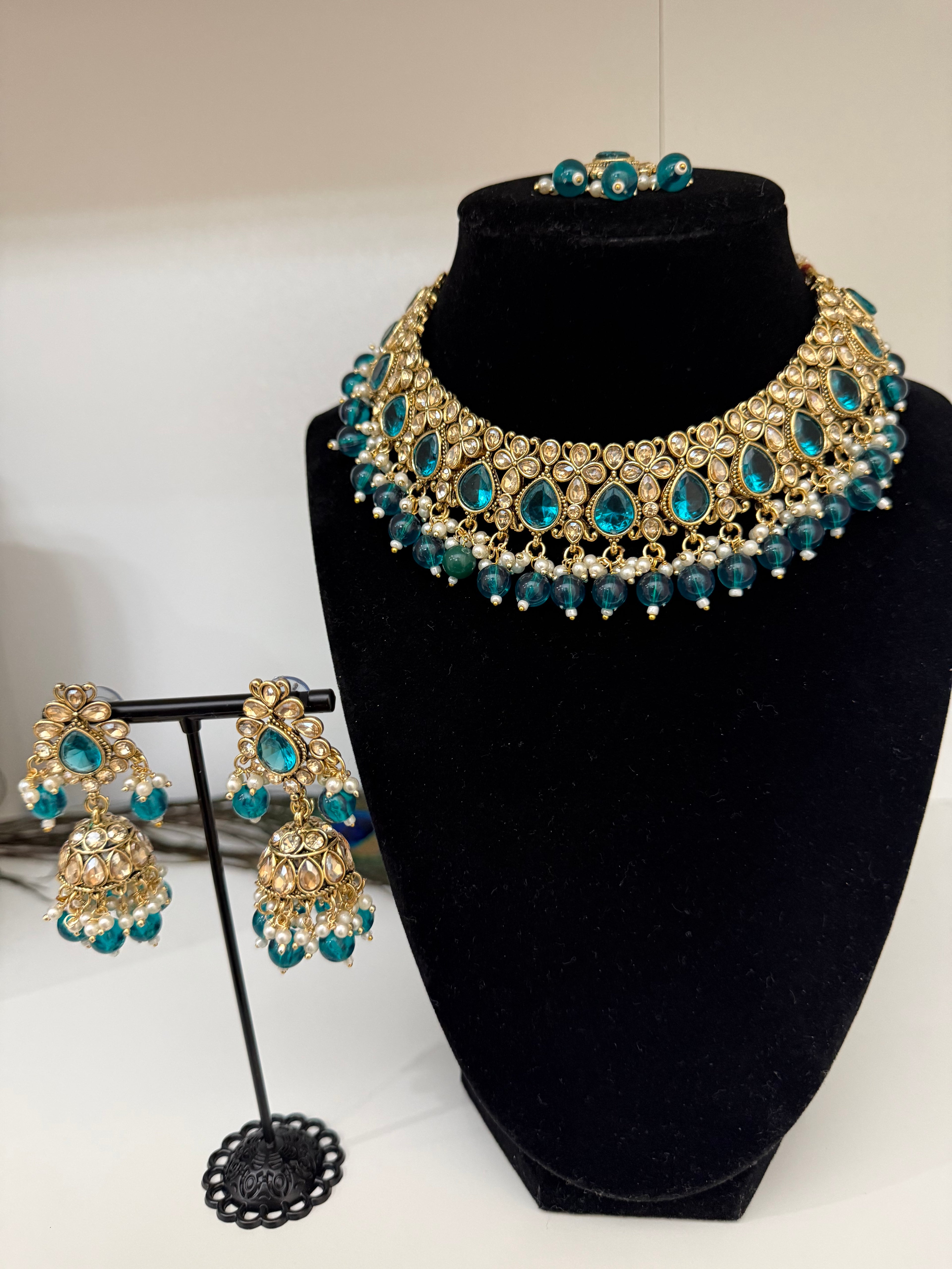 Kundan choker necklace (gold-tone with teal/emerald-colored stones and pearl drops)